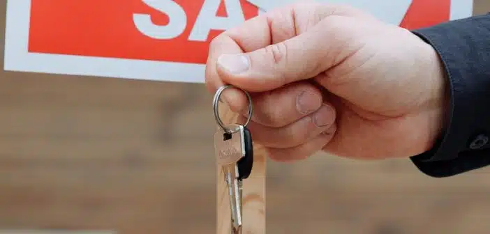 Person Handing Out Keys to Another Person