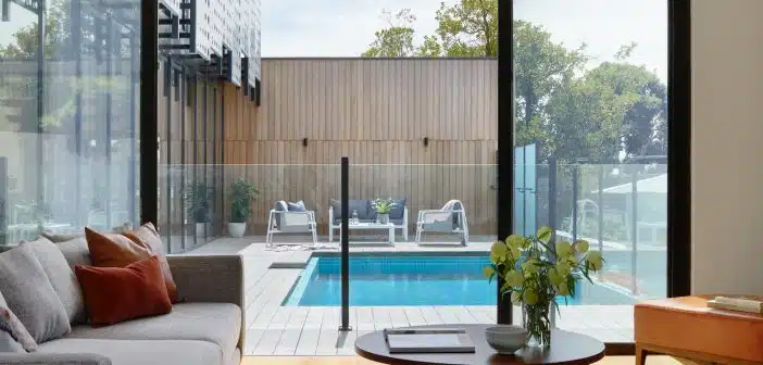 brown sofa near glass window